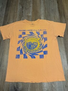 Sublime T-shirt featuring the 40oz to Freedom" sun graphic.